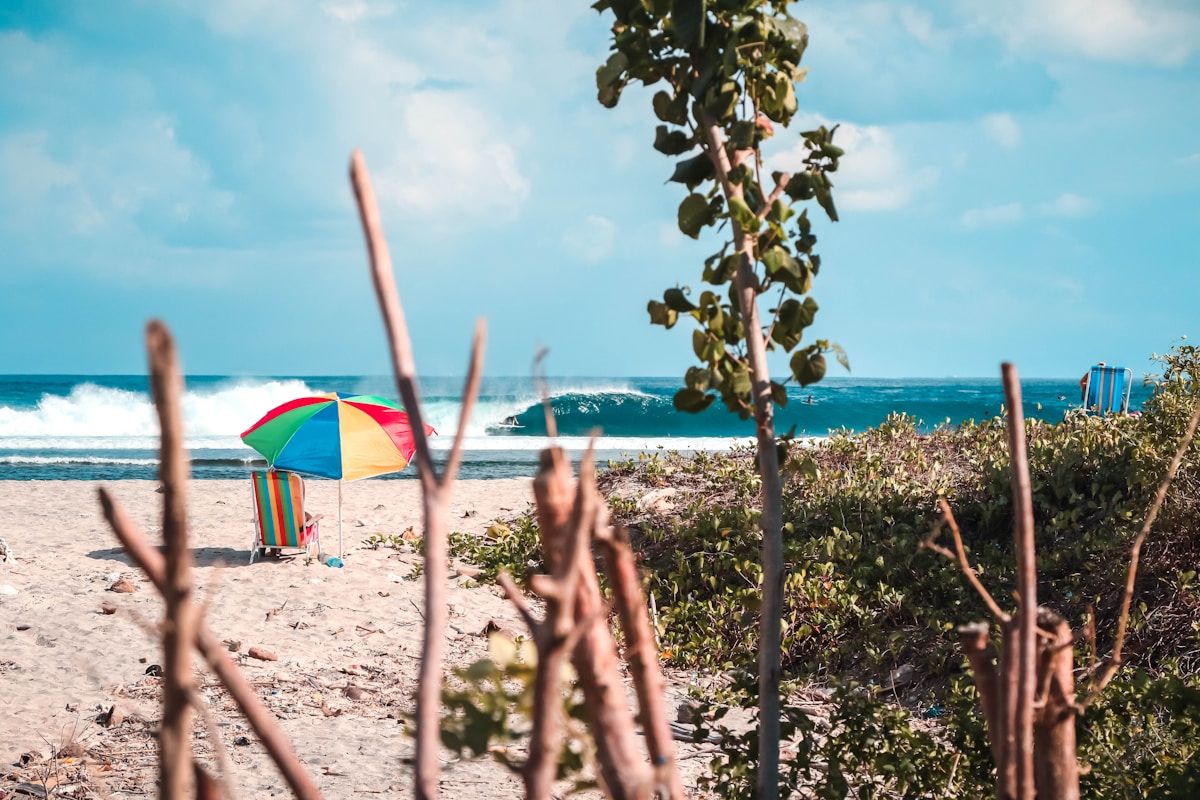Giant granite boulders on a white sand beach with turquoise water, Belitung Island