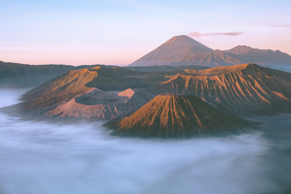 Mount Rinjani volcano at sunrise above the clouds, Lombok, Indonesia